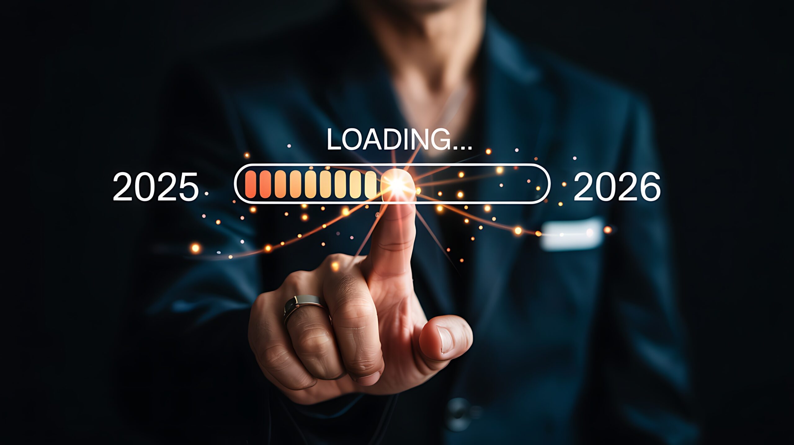 Person s finger touching a loading bar indicating progress from year 2025 to 2026 with digital futuristic elements
